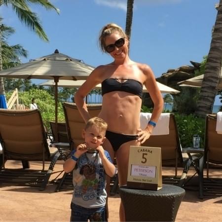 Summer Peterson with son on cabana